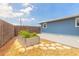 Charming backyard featuring a garden bed, a concrete patio, and a wooden fence at 1032 Bel Aire Dr, Daytona Beach, FL 32118