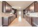Modern kitchen with dark wood cabinets, stainless steel appliances, and tiled backsplash at 1032 Bel Aire Dr, Daytona Beach, FL 32118