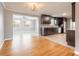 Charming kitchen with stainless steel appliances, dark wood cabinets and hardwood floors at 1032 Bel Aire Dr, Daytona Beach, FL 32118