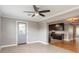 Inviting living room offers tiled floors and flows into a modern kitchen with custom cabinets at 1032 Bel Aire Dr, Daytona Beach, FL 32118