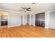 Large main bedroom has hardwood floors, a ceiling fan and a luxurious ensuite bathroom at 1032 Bel Aire Dr, Daytona Beach, FL 32118