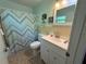 Bathroom featuring a tile floor, updated vanity, a toilet, and a shower with curtain at 1081 Cobblestone Ave, Deltona, FL 32725