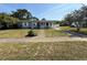 Charming single-story home featuring a cozy front porch and a convenient covered carport at 1081 Cobblestone Ave, Deltona, FL 32725
