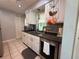 Functional kitchen featuring white cabinets, stainless steel appliances, and tiled backsplash at 1081 Cobblestone Ave, Deltona, FL 32725