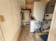 Compact laundry area with stacked washer and dryer at 1081 Cobblestone Ave, Deltona, FL 32725