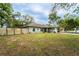 The backyard is fully fenced with a large green lawn, providing a safe and private space for outdoor activities at 1113 Fort Smith Blvd, Deltona, FL 32725