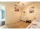 Bedroom featuring a twin bed, white dresser with mirror, and charming decor at 1113 Fort Smith Blvd, Deltona, FL 32725