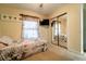 Charming bedroom featuring a twin bed with a mirror sliding closet and decor at 1113 Fort Smith Blvd, Deltona, FL 32725