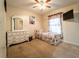 Cozy bedroom with a twin bed, white dresser with mirror, and charming decor at 1113 Fort Smith Blvd, Deltona, FL 32725