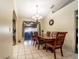 Well-lit dining room features tiled flooring, ample seating, and elegant lighting fixture at 1113 Fort Smith Blvd, Deltona, FL 32725