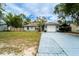 Inviting single-story home featuring a well-maintained lawn, attached garage, and covered parking, perfect for suburban living at 1113 Fort Smith Blvd, Deltona, FL 32725