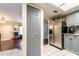View from kitchen featuring stainless steel refrigerator, closet and doorway to living room at 1113 Fort Smith Blvd, Deltona, FL 32725
