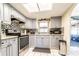 Open kitchen featuring stainless steel appliances, granite countertops, and access to outdoor area at 1113 Fort Smith Blvd, Deltona, FL 32725