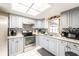Updated kitchen featuring stainless steel appliances, granite countertops, and tile flooring at 1113 Fort Smith Blvd, Deltona, FL 32725