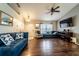 Inviting living room features hardwood flooring and seamless transition to other living spaces at 1113 Fort Smith Blvd, Deltona, FL 32725