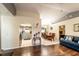 Inviting living room with seamless transition to dining area, showcasing an open-concept design at 1113 Fort Smith Blvd, Deltona, FL 32725