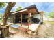 Outdoor patio area features tile flooring, covered section, storage and offers outdoor entertaining space at 1113 Fort Smith Blvd, Deltona, FL 32725