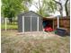 Outdoor storage shed offers space for tools and equipment, nestled in a spacious backyard at 1113 Fort Smith Blvd, Deltona, FL 32725