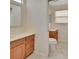 Bathroom showcasing dual sink vanity and toilet with tile flooring at 1142 Glendale Ave, Deltona, FL 32725