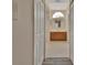 Bathroom with double doors, tile floor, and sink with wood cabinets at 1142 Glendale Ave, Deltona, FL 32725