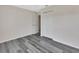 This bedroom features gray wood-look floors and a closet for ample storage at 1142 Glendale Ave, Deltona, FL 32725