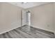 Bedroom boasts stylish gray wood-look floors and natural light at 1142 Glendale Ave, Deltona, FL 32725