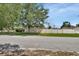 Exterior street view highlighting the long fence and landscaping at 1142 Glendale Ave, Deltona, FL 32725