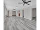 Spacious living area featuring wood-look flooring and natural light at 1142 Glendale Ave, Deltona, FL 32725