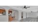 Open-concept living area with kitchen, hardwood floors, and neutral color palette at 1142 Glendale Ave, Deltona, FL 32725