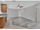 Living room area with updated flooring that opens into the kitchen at 1142 Glendale Ave, Deltona, FL 32725
