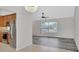 Open-concept room with tile floors and a chandelier with views into the kitchen and living room at 1142 Glendale Ave, Deltona, FL 32725