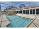 Enjoy the Florida sun with this screened-in pool and spacious patio at 1142 Glendale Ave, Deltona, FL 32725