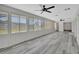 Spacious sunroom filled with natural light, featuring neutral colored floors at 1142 Glendale Ave, Deltona, FL 32725