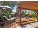 Backyard patio area for entertaining with outdoor seating, fire pit, and lush landscape features at 115 Oaks Ct # 115, Sanford, FL 32771