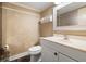Powder room featuring decorative walls, patterned floors, and a white vanity at 115 Oaks Ct # 115, Sanford, FL 32771