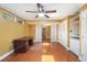Bright bedroom featuring hardwood floors, storage, and an ensuite bathroom at 115 Oaks Ct # 115, Sanford, FL 32771