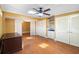 Bright bedroom featuring hardwood floors, storage, and an ensuite bathroom at 115 Oaks Ct # 115, Sanford, FL 32771