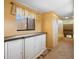Hallway with built-in white cabinets, a window, carpet and light walls at 115 Oaks Ct # 115, Sanford, FL 32771