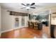Open kitchen view highlighting dark cabinetry, granite countertops, stainless steel appliances, and access to the breakfast nook at 115 Oaks Ct # 115, Sanford, FL 32771