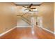 Spacious living room featuring high ceilings, a staircase, and hardwood floors, filled with natural light at 115 Oaks Ct # 115, Sanford, FL 32771