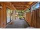 Private covered patio with an outdoor sitting area and entrance to the home at 115 Oaks Ct # 115, Sanford, FL 32771