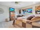 Bedroom featuring a dresser, TV, and bright window at 1155 E Fowler Dr, Deltona, FL 32725