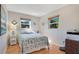 Comfortable bedroom with warm wood floors and plenty of natural light at 1155 E Fowler Dr, Deltona, FL 32725