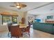 The dining area features a round table with seating for four, adjacent to the living room at 1155 E Fowler Dr, Deltona, FL 32725