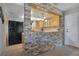 The kitchen has a breakfast bar with tiled countertops and wooden cabinets at 1155 E Fowler Dr, Deltona, FL 32725
