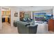 Open-concept living area with views of the water, comfortable sofas, and access to a patio at 1155 E Fowler Dr, Deltona, FL 32725