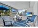 Comfortable sunroom with TV for entertainment and scenic water views at 1155 E Fowler Dr, Deltona, FL 32725