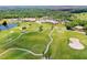 An aerial view showcases the manicured golf courses, landscaping, and community amenities at 1183 Cabot Cliffs Dr, Daytona Beach, FL 32124