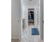 Bright bathroom with tiled floor, glass shower and walk-in closet at 1183 Cabot Cliffs Dr, Daytona Beach, FL 32124