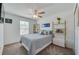 Cozy bedroom featuring a ceiling fan, window and decorative shelving at 1183 Cabot Cliffs Dr, Daytona Beach, FL 32124